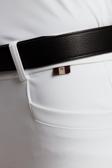 Close-up of white VEL DE REIS riding breeches waistband with belt loop and branded tab detail