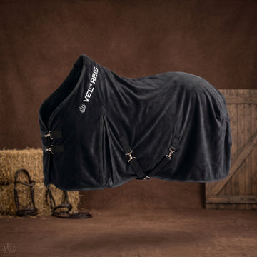 Black horse fleece blanket with vel de reis branding on a brown background