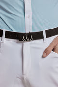 A close-up of a person wearing a dark brown textured leather belt with a silver-toned curved metal buckle, paired with white trousers and a light blue and white striped shirt.