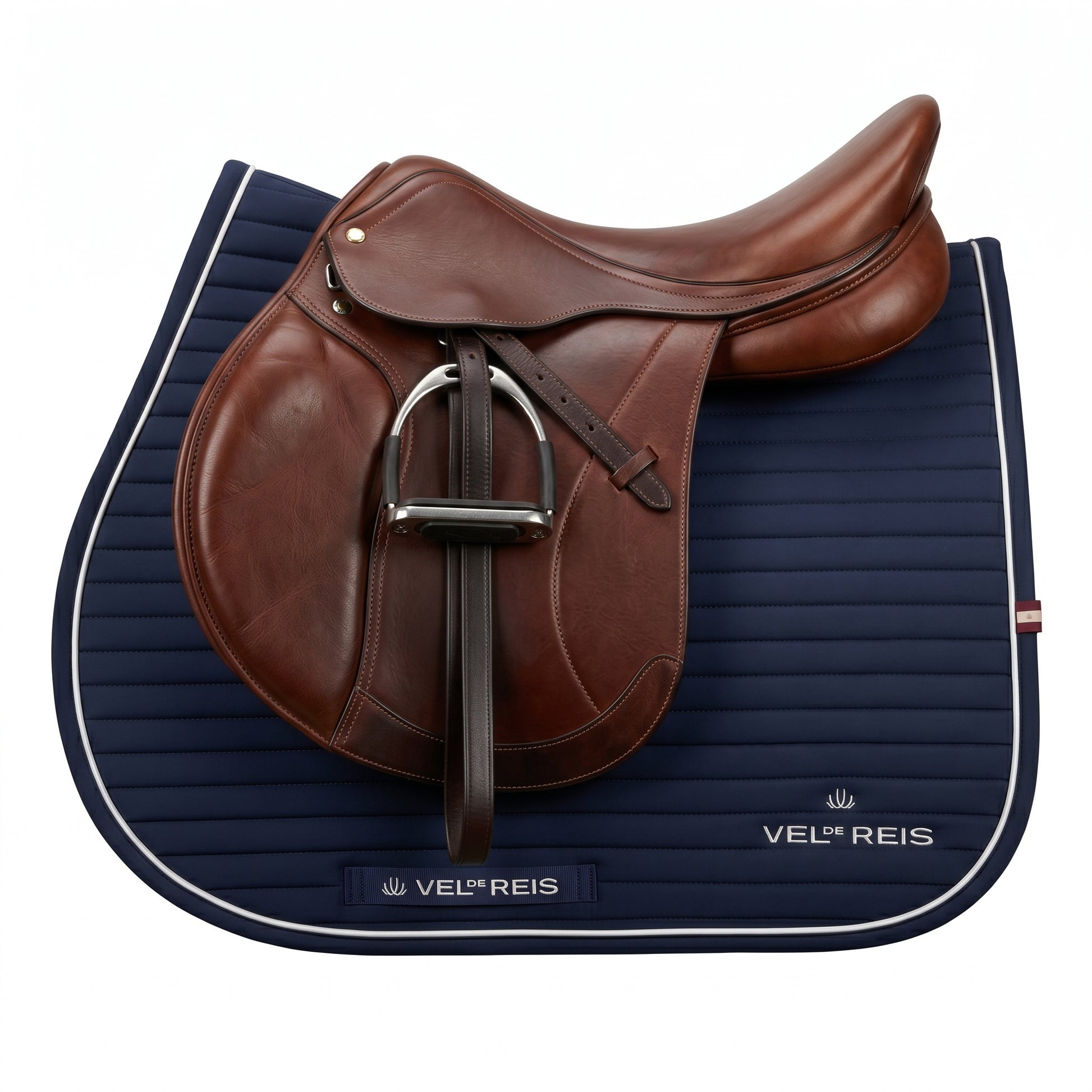 Brown saddle on a VEL DE REIS blue saddle pad with Vel de Reis branding
