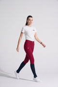 Woman wearing red with rhinestones branding