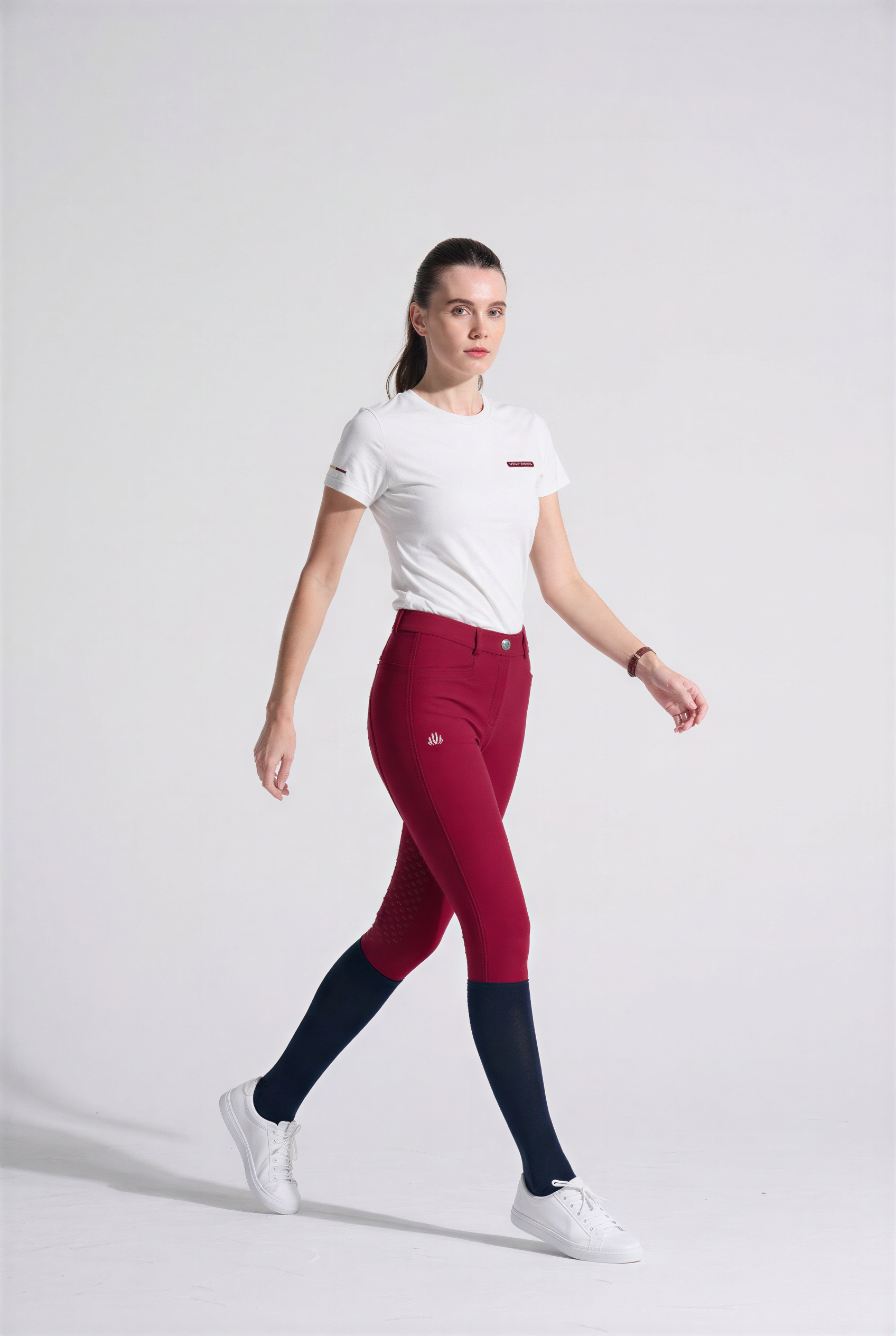 Woman wearing red with rhinestones branding